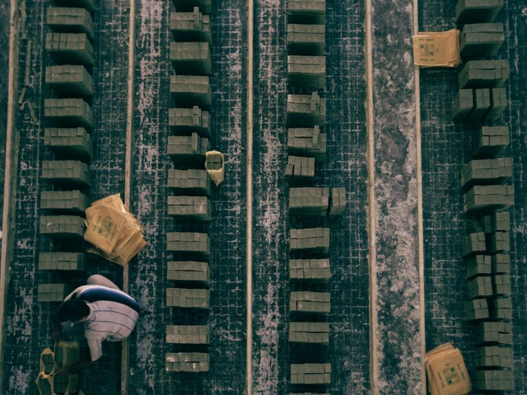 Top view of stacked wooden blocks in an industrial setting, showcasing alignment and organization.